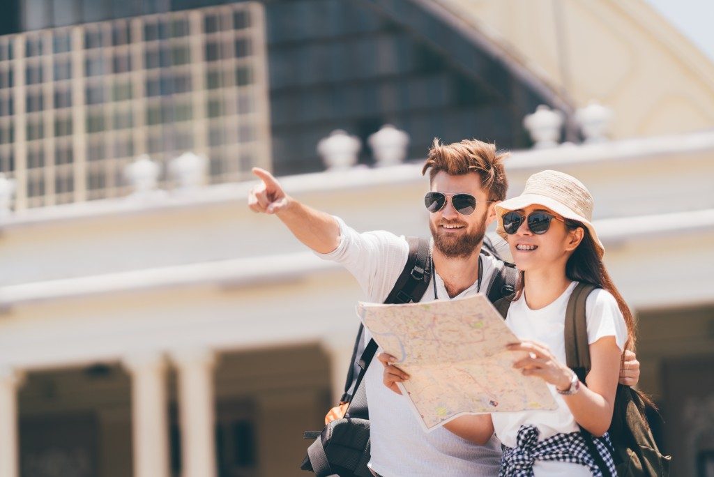 Couple traveling with map