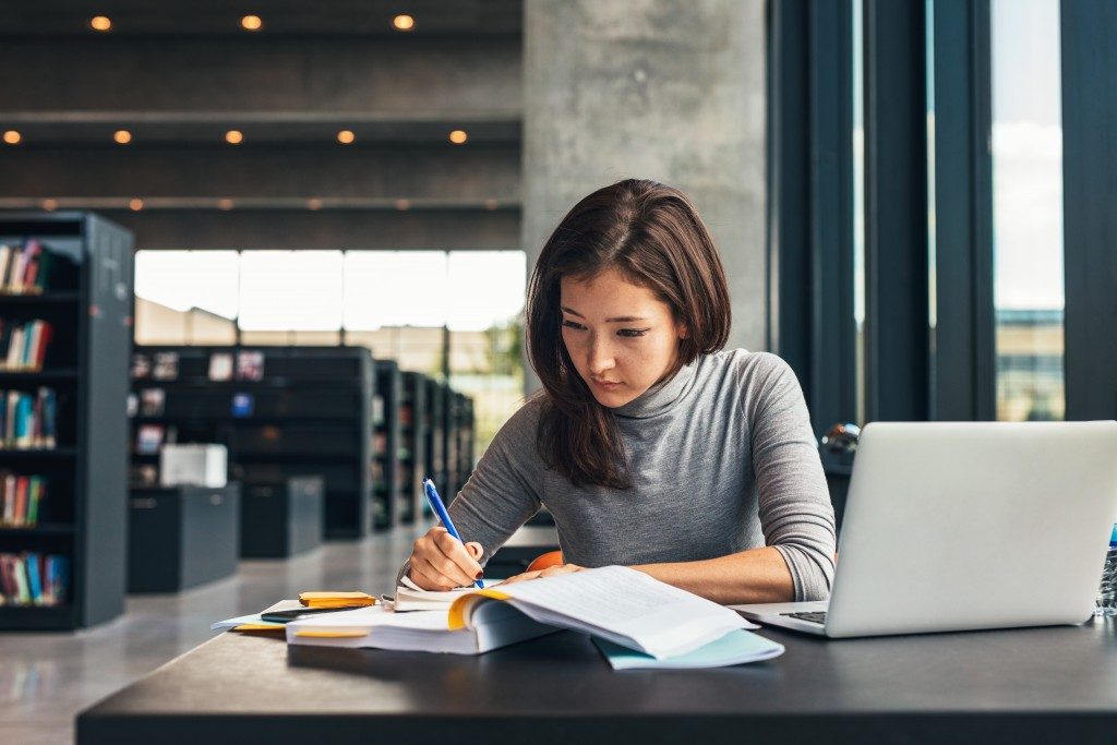 College student studying at the library