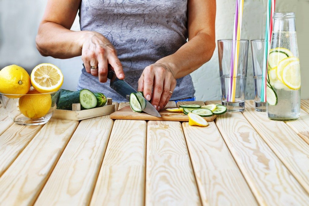 woman slicing fruits