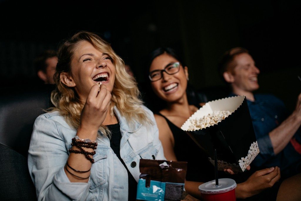 Woman watching a movie with a friend