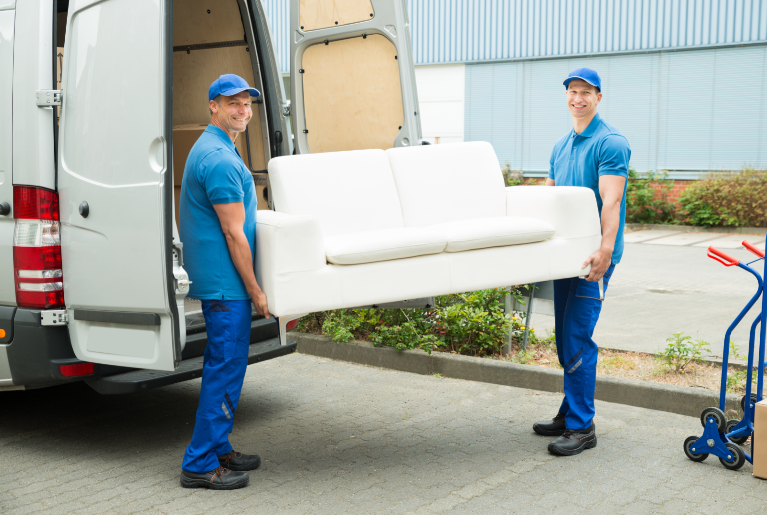 Professional movers carrying a sofa