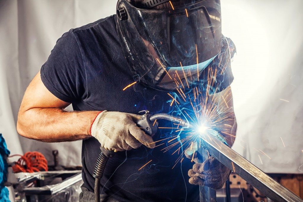 Man welding on a metal