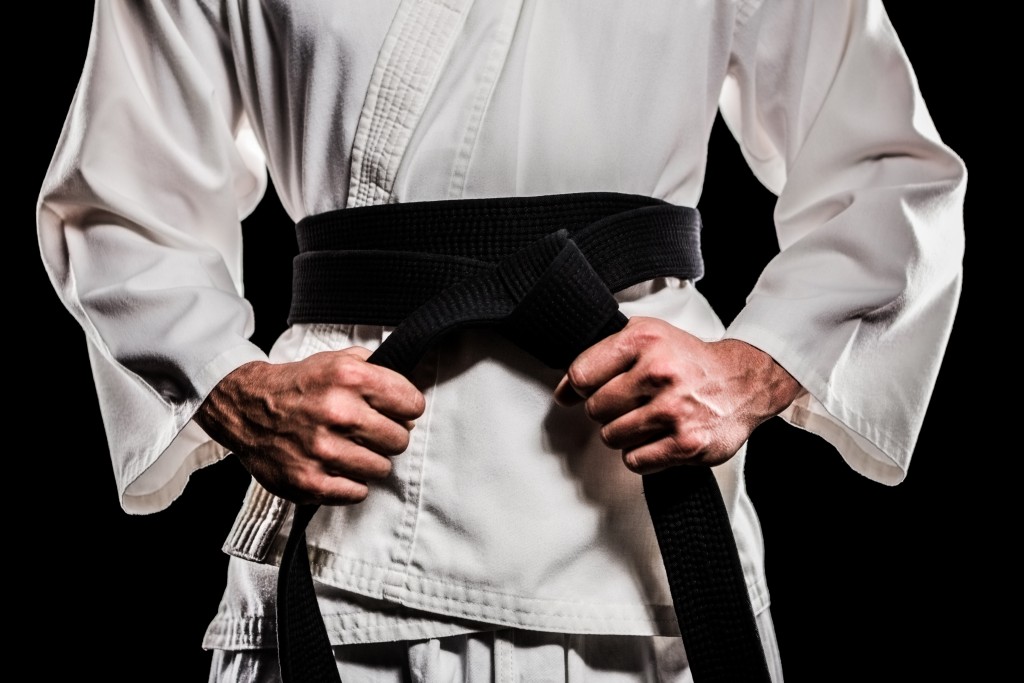 Fighter tightening his karate belt