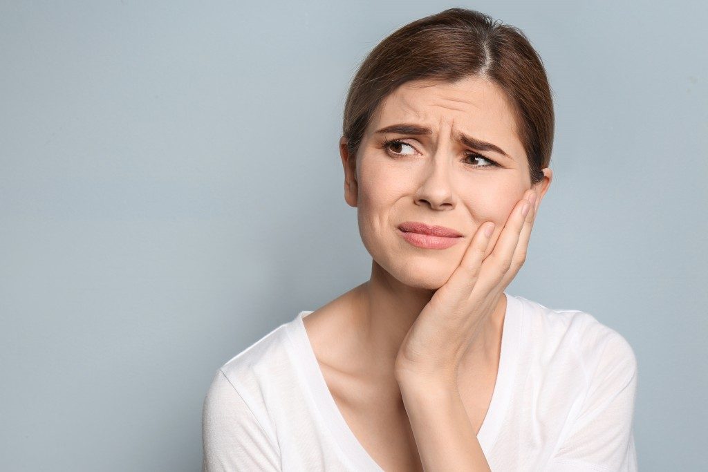 Woman suffering from toothache