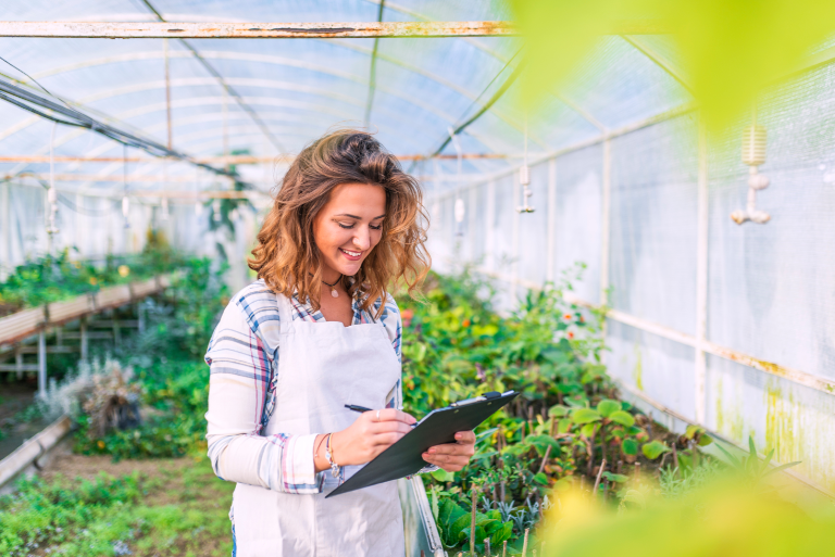 Woman working in a greenhouse