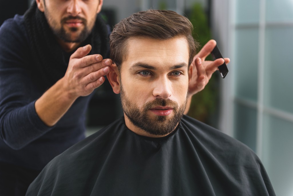 Man at the barbershop getting his hair done