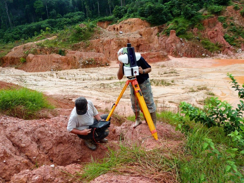 man setting up for land surveying
