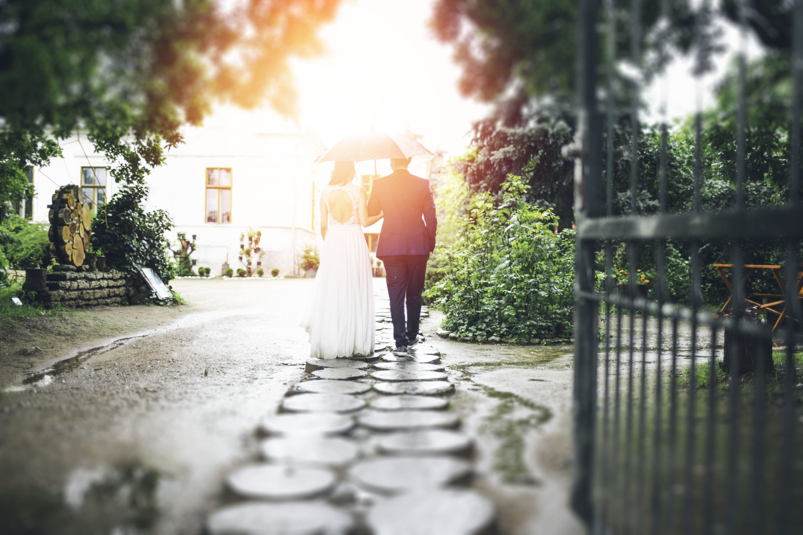 groom and bride holding hands